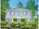 Charming home with a symmetrical facade, classic shutters, and mature landscaping at 2987 Windward Nw Dr, Kennesaw, GA 30152