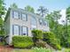 Beautiful two-story home with brick facade, manicured greenery, and timeless architectural details at 2987 Windward Nw Dr, Kennesaw, GA 30152