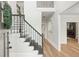 Bright foyer with hardwood floors, staircase, and neutral paint at 2987 Windward Nw Dr, Kennesaw, GA 30152