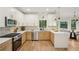 Bright and updated kitchen with an island, stainless steel appliances, and an open layout at 2987 Windward Nw Dr, Kennesaw, GA 30152