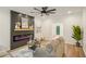 Stylish living room with a chic fireplace, modern decor, and hardwood flooring at 2987 Windward Nw Dr, Kennesaw, GA 30152