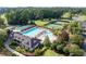 Beautiful aerial view of the community pool, tennis courts, and lush landscaping at 3353 Greenfield Dr, Marietta, GA 30068
