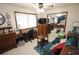Functional bedroom with desk, sitting area, and neutral colored carpet at 3353 Greenfield Dr, Marietta, GA 30068