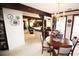 Open dining room featuring a wooden table, chandelier, and view into the kitchen at 3353 Greenfield Dr, Marietta, GA 30068