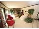 Cozy living room features a fireplace, neutral carpet, and large windows at 3353 Greenfield Dr, Marietta, GA 30068