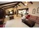 Open living room with exposed beams, comfortable seating, and access to the kitchen at 3353 Greenfield Dr, Marietta, GA 30068