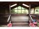 Charming porch with wooden beams, skylights, and outdoor seating at 3353 Greenfield Dr, Marietta, GA 30068