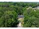 Aerial shot showcasing a well-maintained home surrounded by lush greenery and mature trees at 140 Emily Sw Dr, Lilburn, GA 30047