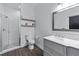 Bathroom showcasing shower, toilet, and vanity with a white marble countertop and decorative mirror at 140 Emily Sw Dr, Lilburn, GA 30047