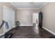 Bedroom with dark wood flooring, closet with bi-fold doors, and a ceiling fan at 140 Emily Sw Dr, Lilburn, GA 30047