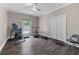 Bedroom with ceiling fan, a window, and closet with bi-fold doors at 140 Emily Sw Dr, Lilburn, GA 30047