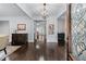 Elegant entryway featuring hardwood floors, decorative chandelier, and tasteful decor at 140 Emily Sw Dr, Lilburn, GA 30047