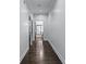 Hallway showcasing hardwood floors with view of bath at 140 Emily Sw Dr, Lilburn, GA 30047