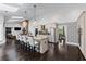 Spacious kitchen with white cabinets, a large island, pendant lighting, and stainless steel appliances at 140 Emily Sw Dr, Lilburn, GA 30047