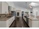 Bright kitchen with large island, stainless appliances, and high ceilings at 140 Emily Sw Dr, Lilburn, GA 30047