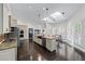 Spacious kitchen features a large island, barstool seating, and modern stainless steel appliances at 140 Emily Sw Dr, Lilburn, GA 30047