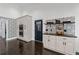 Kitchen features white cabinets, built-in double ovens, and patterned tile wall at 140 Emily Sw Dr, Lilburn, GA 30047