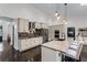 Kitchen with stainless steel appliances, granite countertops, and breakfast bar at 140 Emily Sw Dr, Lilburn, GA 30047