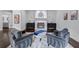 Elegant living room features stylish seating, a fireplace with a decorative mirror, and dark hardwood floors at 140 Emily Sw Dr, Lilburn, GA 30047