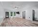 Open main bedroom featuring walkout access and large windows for natural light at 140 Emily Sw Dr, Lilburn, GA 30047