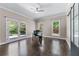 Office space features hardwood floors, large glass doors leading to backyard, and natural light at 140 Emily Sw Dr, Lilburn, GA 30047