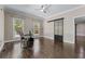 Bright home office space with hardwood floors, and a stylish sliding barn door leading to an adjacent room at 140 Emily Sw Dr, Lilburn, GA 30047