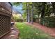 Spacious backyard with lush lawn, mature trees, and a deck area at 1887 Chamdun Pl, Brookhaven, GA 30341