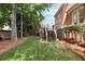 Landscaped backyard showing deck stairs and lawn at 1887 Chamdun Pl, Brookhaven, GA 30341