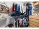 Walk-in closet with rods and shelves to maximize organization of clothing, accessories and shoes at 1887 Chamdun Pl, Brookhaven, GA 30341