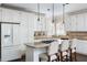 Bright kitchen with stainless steel appliances, granite countertops, and an island with bar seating for casual dining at 1887 Chamdun Pl, Brookhaven, GA 30341