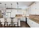 Well-equipped kitchen featuring an island with bar stools, stainless steel appliances, and ample cabinet space at 1887 Chamdun Pl, Brookhaven, GA 30341