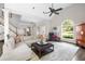 Spacious living area with an vaulted ceiling, large windows, comfortable seating, and stylish decor at 1887 Chamdun Pl, Brookhaven, GA 30341