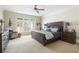 Serene main bedroom with large windows, plantation shutters, neutral tones, and a comfortable king-size bed at 1887 Chamdun Pl, Brookhaven, GA 30341