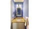 Cozy powder room featuring an ornate mirror, granite countertop, and soft lighting at 1887 Chamdun Pl, Brookhaven, GA 30341