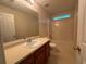 Bathroom featuring a tub/shower combo, vanity sink, and neutral wall paint at 218 Osmanthus Way, Canton, GA 30114