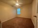 Bedroom with neutral carpet, ceiling fan, and natural light from a window at 218 Osmanthus Way, Canton, GA 30114