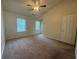 Bedroom features natural light and carpet flooring at 218 Osmanthus Way, Canton, GA 30114