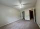 Bedroom showcases plush carpeting, ceiling fan, closet, and easy access to the hallway at 218 Osmanthus Way, Canton, GA 30114
