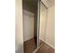 Bedroom closet featuring mirrored sliding doors and wire shelving for optimal storage at 218 Osmanthus Way, Canton, GA 30114