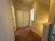 Upstairs hallway featuring soft carpeting and access to a closet at 218 Osmanthus Way, Canton, GA 30114