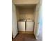 Laundry area with washer, dryer, and closet for storage at 218 Osmanthus Way, Canton, GA 30114