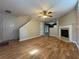 Spacious living area boasting hardwood floors, fireplace, and entry to kitchen at 218 Osmanthus Way, Canton, GA 30114