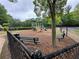 Community playground with slides, climbing structures, and seating areas for residents at 218 Osmanthus Way, Canton, GA 30114