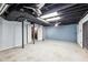 Unfinished basement featuring painted ceilings, support beams, and cement walls at 402 Summit Ridge Ter, Lawrenceville, GA 30046