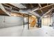Unfinished basement featuring exposed ductwork, stairs, and cement walls at 402 Summit Ridge Ter, Lawrenceville, GA 30046