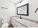 Bathroom featuring granite counters, white cabinets and updated fixtures at 402 Summit Ridge Ter, Lawrenceville, GA 30046