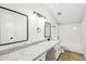A spacious bathroom with a shower, toilet, and granite-topped vanity with black hardware at 402 Summit Ridge Ter, Lawrenceville, GA 30046