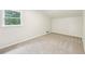 Bedroom featuring a window for natural light and cozy carpet flooring at 402 Summit Ridge Ter, Lawrenceville, GA 30046