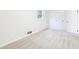 Bright bedroom featuring neutral carpet, white walls, and natural light from a window at 402 Summit Ridge Ter, Lawrenceville, GA 30046