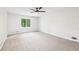 Large bright bedroom with plush carpet and a ceiling fan at 402 Summit Ridge Ter, Lawrenceville, GA 30046
